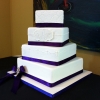 Monogrammed White Fondant Cake with Purple Ribbon