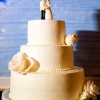 Classic White Wedding Cake with Traditional Bride and Groom Cake Topper