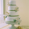 Wedding Cake with Green Ribbon and Daisies