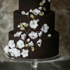 Brown Wedding Cake with White Flowers