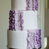 White Wedding Cake with Purple Ruffles