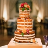 Naked Wedding Cake with Berries and Flowers