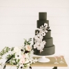 Black Wedding Cake with Cascading White Flowers