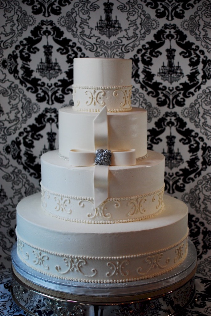 Scroll pattern white wedding cake Today we show another installment in the