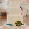 White Wedding Cake with Succulents and Teal Trim