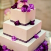 White Wedding Cake with Purple Flowers