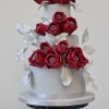 White Wedding Cake with Red Roses