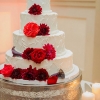 White Wedding Cake with Red Flowers