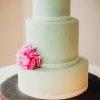 Green Wedding Cake with a Pink Flower