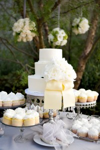 White wedding cake with cream ribbon
