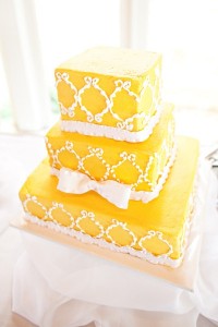 yellow ruffled ribbon square wedding cake