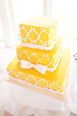 yellow ruffled ribbon square wedding cake