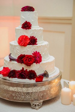 white cake with red flowers