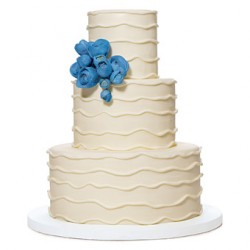 white cake with blue flowers